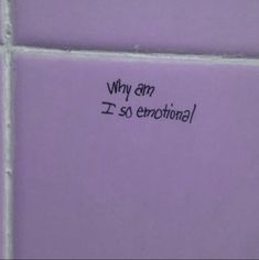 a pink tile wall with the words why am i so emotion? written on it