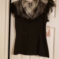 This Is A Ladies Large Little Black Top. It Has A V-Neck With Lace. It Is By Six Degrees Of Separation. It Runs A Little Small On The Length. It Is Brand New With Tags. It Is Made Of 60% Polyester, 35% Rayon And 5% Spandex. It Comes From A Clean And Smoke Free Home. Fitted V-neck Lace Top For Party, Stretch Lace V-neck Top, Party Lace Top With V-neck, Lace Top V-neck For Night Out, Black V-neck Blouse With Lace Trim, V-neck Party Tops With Lace Trim, V-neck Party Top With Lace Trim, V-neck Lace Top Blouse For Night Out, Fitted V-neck Blouse With Lace Top