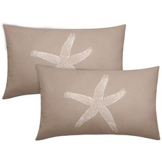 two beige pillows with white embroidered starfishs on the front and back of them