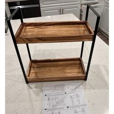 a wooden shelf sitting on top of a kitchen counter next to a white tile floor