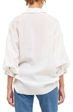 Voluminous three-quarter sleeves frame this billowy woven shirt featuring a notched collar. Notched collar Three-quarter sleeves Lined 80% rayon, 20% nylon Hand wash, dry flat Imported Chic Long Sleeve Blouse With Roll-up Sleeves, Chic White Blouse With Roll-up Sleeves, White Blouson Sleeve Button-up Blouse, White Button-up Blouse With Blouson Sleeves, White Button-up Top With Blouson Sleeves, Summer Button-up Tops With Blouson Sleeves, Spring Daywear Blouse With Roll-up Sleeves, Spring Shirt With Blouson Sleeves And Relaxed Fit, Relaxed Fit Blouse With Roll-up Sleeves For Spring