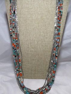 Only wore a few times...look great with my denim jacket...loved the long length and the colorful beads against the silver tone beads...measure 28" But you can get an extra 3" with the extension chain...the CHICO'S tag fell off years ago, but the necklace has held up quite well. White Turquoise, Orange And Turquoise, Black Glass, Metal Beads, Bead Work, Silver Tone, Halloween Shopping, Glass Beads, Beaded Necklace