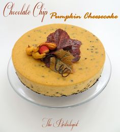 a chocolate chip pumpkin cheesecake on a plate with the words, chocolate chip pumpkin cheesecake