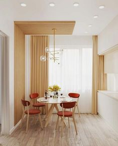 a dining room table with four chairs around it