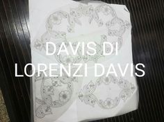 a white sheet with black and white designs on it, next to the words davis di lorenzoi davis