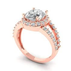 a rose gold engagement ring with an oval diamond center and side stones on the band