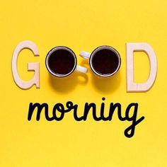 two cups of coffee sitting on top of a yellow surface with the words good morning