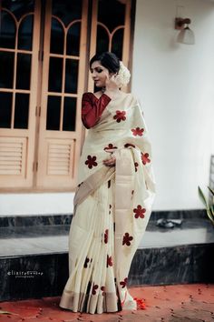 Fabric :   Tissue with Appliq design Color :      Maroon Kasavu :   Light Kasavu Pallu :       5 inch Kasavu Border :    4 inch Kasavu Tussles(Kunchalam) : yes Blouse :    With approx. 1 mtr Unstitched Blouse and one meter extra contrast blouse Saree length : 6.25 meter with blouse This is a special weave from the talented weavers of Kuthampully  Gentle cold water hand wash only. Dry clean recommended.   Do not soak in detergent for a longer duration. Off White Art Silk Saree With Cutdana, White Handloom Art Silk Pre-draped Saree, Tissue Silk Saree With Resham Embroidery For Puja, Resham Embroidery Tissue Silk Saree For Puja, Off White Cutdana Saree For Puja, Off White Cotton Silk Saree For Festive Occasions, Festive Off-white Chanderi Saree, Festive Off White Cotton Silk Saree, White Tussar Silk Fabric With Cutdana Embroidery