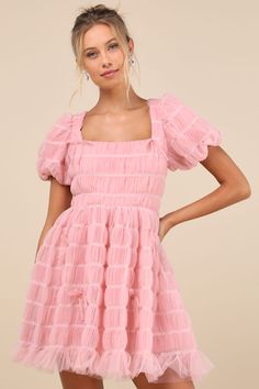 Flirt your way through all the cutest events in the Lulus Utterly Adored Pink Tulle Textured Puff Sleeve Bow Mini Dress! Dreamy tulle boasts a cloud-like textured effect (with contrasting white stitching) as it shapes short puff sleeves with elastic at the cuffs. Square neckline tops a princess-seamed bodice with a single tie at the back and a fitted waist. Skirt has a flaring silhouette that ends at a ruffled mini hem. Darling bow details throughout lend a coquette finish. Hidden zipper/clasp at back. Fit: This garment fits true to size. Length: Mid-thigh. Size medium measures 33" from shoulder to hem. Bust: Great for any cup size. Waist: Fitted - very fitted at natural waist. Hip: Not Fitted - fuller skirt allows room for hips. Undergarments: May be worn with a strapless bra, adhesive br Light Pink Puffy Sleeve Dress, Pink Puffy Sleeve Dress, Tulle Texture, Puffy Sleeve Dress, Bow Mini Dress, Pink Dress Short, Puff Sleeve Mini Dress, Textured Dress, Pink Tulle