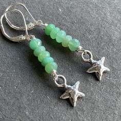 Bright beautiful faceted chrysoprase wired in sterling silver show off a sweet solid sterling silver artisan star. The approximate length is 1 7/8". The leverbacks shown are an upgrade. Please choose your earwire preference. Your jewelry will arrive beautifully giftboxed. Nickel-free Silver Chrysoprase Jewelry, Nickel-free Chrysoprase Jewelry Gift, Handmade Green Star-shaped Jewelry, Green Star-shaped Handmade Jewelry, Adjustable Silver Jewelry With Chrysoprase, Adjustable Silver Chrysoprase Jewelry, Pebble Jewelry, Hardware Jewelry, Silver Turquoise Earrings