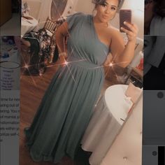 a woman in a dress taking a selfie with her cell phone while standing next to a mirror