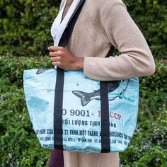 Our sustainable beach bag is ready for adventure. Made from recycled feed bags, it’s lightweight, water resistant and a perfect size. Extra long shoulder straps make it comfortable to carry even when it’s stuffed to the brim. The zip close keeps everything secure and it also makes a great overnight or carry on option. So easy to care for too! Simply hose it out and flip it upside down to let it dry. Recycled Feed Bag Zip Closure Double Ply Interior Zip Pocket18"L x 8"W x 13"H Blue Recyclable Beach Bag For Travel, Eco-friendly Upcycled Beach Bags, Eco-friendly Recyclable Beach Bag, Recyclable Tote Bag For Outdoor Activities, Eco-friendly Upcycled Bags From Recycled Materials, Casual Travel Shoulder Bag Made Of Recycled Materials, Eco-friendly Recyclable Beach Bag For Everyday Use, Eco-friendly Bags For Outdoor Activities, Eco-friendly Travel Bags Made From Recycled Plastic