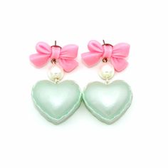 "These adorable earrings are perfect for Valentine's Day or anytime of the year! Pastel pearl finish heart shaped macaron charms filled with whipped cream hung below pink bow posts with glass pearls. Posts are hypoallergenic surgical steel. Choose pink, purple or mint green. Charms are about 1\" wide. Total earring length: about 2\". Matching necklaces and rings in my shop>> https://etsy.com/shop/fatallyfeminine **Made to order - please allow 2 weeks for your item to be made before shipmen Sweet Green Jewelry For Gifts, Cute Heart Drop Earrings For Party, Sweet Pink Heart-shaped Earrings, Cute Party Earrings With Heart Charm, Cute Heart Charm Earrings For Party, Cute Heart Bead Earrings For Party, Cute Heart Earrings For Party, Cute Green Heart Earrings For Gift, Pastel Drop Earrings For Gifts