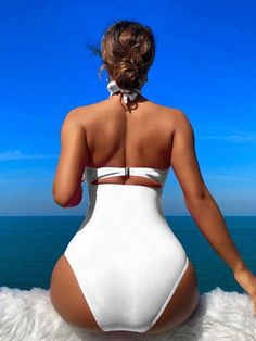 One-piece Bodysuit For Sunbathing, One-piece Bodysuit For Pool, Solid One-piece Bodysuit For Pool, One-piece Lined Bodysuit For Vacation, Solid Color Summer Bodysuit With Halter Neck, Vacation Bodysuit With Lined Body, Solid Halter Neck Bodysuit For Beach, Solid Halter Neck Bodysuit For The Beach, Backless Bodysuit For Beach