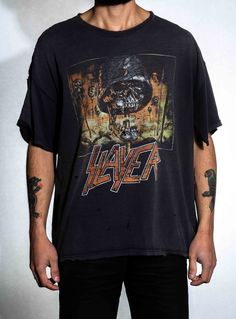 Perfectly worn in vintage Slayer shirt. Fabric is soft and distressed with holes all over. Holes in armpit.  Size Large Across Shoulder: 22 in Length: 24 in Sleeve: 6 in Edgy Faded Distressed T-shirt, Distressed Rock T-shirt For Streetwear, Grunge Washed Top For Streetwear, Washed Grunge Top For Streetwear, Stonewashed Band Merch T-shirt For Streetwear, Band Merch Washed Tops For Streetwear, Vintage Ripped Crew Neck Top, Acid Wash Ripped T-shirt For Streetwear, Concert Distressed Washed Black T-shirt