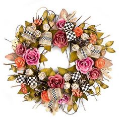 a wreath with flowers and ribbons hanging on the front door or wall, decorated with checkered ribbon