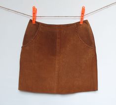 "Short skirt with lined pockets. Invisible zipper on the side.  Material: Genuine suede, 100% Leather  Size: 13  Length: 17 3/4\" or 45.5 cm  Front waist width: 16\" or 41 cm  Front hip width: 21\" or 54.5 cm  **Small defect: see close-up at the bottom of the zipper." Brown Suede Skirt, Cowboy Cowgirl, Suede Skirt, Cowboy And Cowgirl, Camel Color, Skirt Pattern, Invisible Zipper, Western Style, Brown Suede