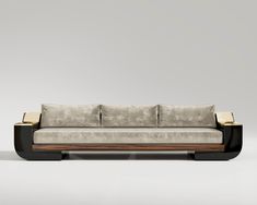 a couch with two pillows on top of it and a wooden frame around the back