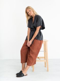 "ELI is a short sleeve linen kimono jacket. DETAILS - Kimono style - Self tie belt - Short sleeve - 100% lightweight European linen fabric - Cut and sewn to order just for you in our studio COLOR - Dark Grey, you can also choose other colors above - Fabric samples are available here https://www.etsy.com/listing/586569696/linen-fabric-samples SIZING & FIT - Relaxed fit - Length (shoulder to hem) is approximately 26 inches / 66 cm - Bust (pit to pit) is approximately 25.5 inches / 65 cm - Slee Casual Linen Kimono With Relaxed Fit, Casual Wrap Kimono With Tie Waist, Casual Linen Kimono With Kimono Sleeves, Relaxed Fit Short Sleeve Kimono For Spring, Gray Kimono, Kimono Wrap Top, Moda Kimono, Wide Leg Linen Trousers, Kimono Style Tops