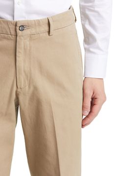 Tailored from soft cotton, these classic flat-front khakis feature a slightly relaxed fit and crisp creases running smartly down the legs. Zip fly with button closure Side-seam pockets; coin pocket 100% cotton Machine wash, tumble dry Imported Formal Straight Leg Cotton Chinos, Classic Business Casual Cotton Bottoms, Business Casual Cotton Bottoms With Flat Front, Classic Cotton Bottoms With Button Closure, Classic Cotton Bottoms With Patch Pockets, Workwear Khaki Chinos With Welt Pockets, Classic Straight Leg Cotton Chinos, Classic Cotton Straight Leg Chinos, Flat Front Cotton Chinos For Business Casual