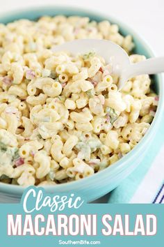 macaroni salad in a blue bowl with a white serving spoon and text overlay that reads classic macaroni salad