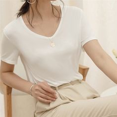 $28.99 USD  elicate V neck design shows a love of simplicity.  Plain color, Easy pull-on style.  Natural Model Fabric, soft and smooth. Elegant Spring T-shirt For Everyday, Solid Color Stretch V-neck T-shirt, Elegant V-neck Plain Tops, Spring Everyday V-neck Top, Elegant V-neck T-shirt For Summer, Plain V-neck T-shirt For Summer, Plain V-neck Tops For Spring, Trendy Solid Color V-neck T-shirt, White V-neck Top