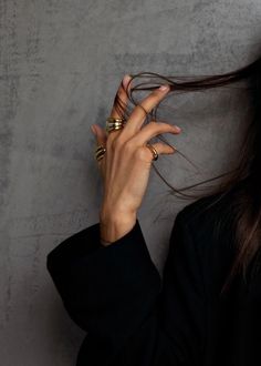 a woman with her hands on her hair