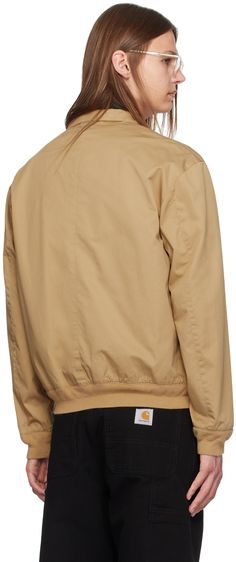 Cotton twill jacket. · Stand collar · Zip closure · Logo embroidered at chest · Flap pockets · Rib knit hem and cuffs · Full cotton twill lining Supplier color: Luxury tan Beige Casual Outerwear With Ribbed Collar, Casual Beige Outerwear With Ribbed Collar, Cotton Outerwear With Ribbed Cuffs For Work, Classic Beige Outerwear With Corduroy Collar, Classic Cotton Outerwear With Ribbed Cuffs, Casual Cotton Outerwear With Contrast Collar, Brown Cotton Outerwear With Ribbed Collar, Cotton Outerwear With Ribbed Collar For Work, Classic Beige Outerwear With Ribbed Cuffs