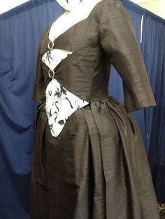 "We are unusually busy this year, so custom sizes require a THREE MONTH wait. Your costume will not be made until late October, and it will NOT ARRIVE IN TIME FOR HALLOWEEN This gown was inspired by Peggy's \"buckle front\" dress from Hamilton. It can be made using any color scheme and a variety of fabrics. It includes four pieces: 1) Fitted, boned overdress/jacket with buckles 2) Very full underskirt 3) Cotton petticoat 4) Bum roll We are happy to make any style/fit/fabric changes you like. The Victorian Wedding Dress With Underbust Style, Victorian Overbust Dress With Historical Design, Victorian Fitted Medieval Dress For Formal Occasions, Victorian Fitted Medieval Formal Dress, Fitted Victorian Costume Dress With Empire Waist, Victorian Gown With Fitted Bodice For Costume Party, Fitted Victorian Dress With Empire Waist For Costume, Victorian Evening Dress With Historical Design, Fitted Victorian Ball Gown Medieval Dress