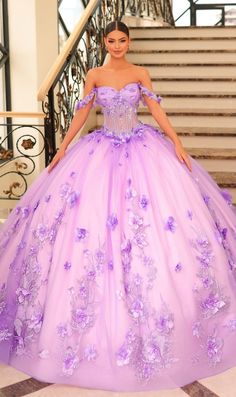 Long off the shoulder tulle a-line quinceanera ball gown with sweetheart neckline, sheer corset bodice and floral applique. Dramatic Prom Dresses, Ballroom Extravaganza, Color Lila Pastel, Floral Ball Gown, Purple Wedding Dress, Voluminous Skirt, Pretty Quinceanera Dresses, Lavender Dress, Quince Dress