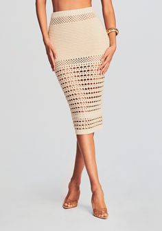 Channel vacation vibes with our Raya Crochet Skirt. This contemporary piece takes crochet to new heights with its cross-stitch cutouts that add an extra layer of artistry and allure. Round out your outfit with our Luiz Crochet Top and Nico Crochet Cardigan to achieve the ultimate coordinated look. Shown here in Ivory/Gold. 85% Cotton, 10% Polyester, 5% Metallic Made in China Model is 5'11" wearing size S Style No. SS23-6767 Australia Clothes, Crochet Skirt Pattern, Dress Night Out, Crochet Skirts, Spring Knits, Vacation Vibes, Rehearsal Dress, Crochet Pumpkin, Chale Crochet