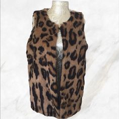 Brand New With Tag On. Romeo And Juliet Couture Sleeveless Faux Fur Vest In Cheetah Print. Size Medium. Gorgeous Addition To Your Wardrobe And A Definite Standout ! Fall Brown Vest Outerwear, Brown Vest Outerwear For Fall, Fitted Faux Fur Outerwear In Leopard Print, Fitted Leopard Print Faux Fur Outerwear, Brown Vest With Faux Fur Trim For Fall, Brown Faux Fur Trim Vest For Fall, Chic Sleeveless Outerwear With Faux Fur Trim, Chic Brown Winter Vest, Fall Sleeveless Outerwear With Faux Fur Trim