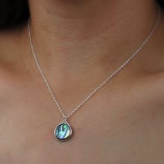 Abalone is one of the most beautiful shells in the ocean. That's why we wrapped these gorgeous shells in quality sterling silver for a perfect pendant. This necklace is 16 inches in length and sits just below the collar bone on most. Please note, all abalone shells vary. The colors include dark and light blues, greens and hints of purple, reds, and browns. Patterns vary from simple to complex swirls, stripes, and anything between! Get this necklace in the perfect light and the colors will shine Paua Shell Jewelry, Beautiful Shells, Clean Sterling Silver, Paua Shell, Necklace Box, Shell Jewelry, Oval Pendant, Circle Pendant, Collar Necklace