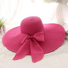 Straw Wide Brim Beach Hat With Bow * Hot Pink * Wide Brim * Foldable * Bow * 100% Polyester * One-Size * Crown: 58cm/22.8" * Hat Comes Folded Pink Casual Straw Hat For Summer, Casual Pink Straw Hat For Summer, Pink Fedora Straw Hat For Summer, Pink Curved Brim Straw Hat For Summer, Pink Short Brim Straw Hat For Beach Season, Pink Straw Hat With Uv Protection For Beach, Pink Panama Hat For Summer Vacation, Wide Brim Pink Straw Hat With Uv Protection, Pink Wide Brim Straw Hat With Uv Protection