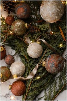 christmas ornaments on a marble table with lights