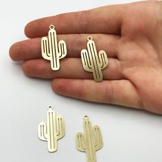 6 pcs Raw Brass Cactus Necklace Charm, Cactus Pendant, Laser Cut Cactus, Jewelry Supplies RW-1028 Size information is shared below Material; Brass Size: 17x32mm Hole Size: 2.00mm Plating: Raw Quantity: Optional If there is any other product you are interested in, please check our site below; All of our products are designed and manufactured by us. If you want to order more products in stock, you can freely contact us. Our Products; -Nickel-free -Lead-free -High quality If you have any questions, Geometric Cactus, Cactus Jewelry, Cactus Necklace, Cactus Earrings, Laser Cut Jewelry, Charms For Jewelry Making, Brass Charms, Necklace Charm, Brass Jewelry