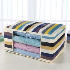 multicolored striped storage bag with zippers on the bottom and sides for clothes