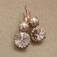 ♡ Genuine Austrian crystals and Pearls ♡ Two-stone lever back setting ♡ Rose Gold plated (nickel free) ♡ 12mm Vintage Rose Rivoli (1/2") ♡ 8mm Rose Gold pearl cabachon (5/16") ♡ 1 1/4" long, 1/2" wide ♡ Handcrafted with love and attention to detail Rose Gold Crystal Earrings, Rose Gold Plate, Rose Gold Pearl, Earrings Rose Gold, Vintage Rose, Rose Earrings, Austrian Crystal, Exquisite Jewelry, Vintage Roses