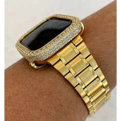 Fits Apple Watch in sizes 38mm 40mm 41mm 42mm 44mm & 45mm Series 1-8 SE. Luxury Yellow Gold Apple Watch Band Stainless Steel in a new Ultra thin and light design with a butterfly buckle. Can be adjusted to fit wrist sizes from 5" to 8 1/4". Easy to resize and comes with a tool/instructions. You can select the set band+bezel, band only or bezel cover only using the drop down menus. Bezel Cover Add a custom 14k white gold plated Metal Case Cover Bezel with hand set micro pave lab diamonds. Two bar Apple Watch Cover, Gold Apple Watch Band, Bezel Band, Gold Apple Watch, Ceramic Watch, Gold Apple, Iwatch Apple, Apple Watch Case, 38mm Apple Watch Band