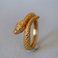 "Solid Gold Snake Ring 14K Ring Diamond Serpent Jewelry gift for her Snake lover Viper ring Gold Snake Jewelry RTS Size 7 not sizable This stunning snake ring in 14K gold with lifelike details is a unique and elegant addition to any jewelry collection. Its realistic snake design and high-quality craftsmanship make it a bold and daring statement piece. Order yours today and add a touch of luxury and sophistication to your look. Size 7 not resizable. ----------------------------------------------- Snake-shaped Diamond Jewelry For Anniversary, Luxury Snake-shaped Diamond Ring, Diamond Snake Shape Jewelry For Anniversary, Snake Shape Diamond Jewelry For Anniversary, Luxury 14k Gold Snake-shaped Ring, Luxury Snake-shaped Wedding Ring, Yellow Gold Diamond Ring In Snake Shape, Elegant Yellow Gold Snake Diamond Ring, Diamond Snake Ring For Wedding