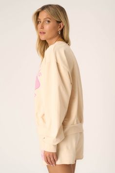 Meet you on the courts.The Pickleball Sweatshirt is inspired by the collegiate aesthetic we all can't get enough of. The playful pink graphic pops on our popular chalk colorway, creating the perfect combo of sporty and girly for spring. And, of course, you're guaranteed comfort with the baby French terry fabric. Pair with the Pickleball Short for the full outfit. 82% Cotton13% Polyester5% Spandex Care Instructions: Machine wash cold. Wash inside out with similar colors. Do not bleach. Lay flat t Pink College Sweatshirt With Ribbed Cuffs, Pink Sweatshirt With Ribbed Cuffs For College, Spring Varsity Style Tops With Relaxed Fit, Varsity Style Relaxed Fit Tops For Spring, Graphic Print French Terry Tops For Loungewear, French Terry Tops With Graphic Print For Loungewear, Oversized Retro Sweatshirt, Casual French Terry Tops For College, Athleisure Tops For College In Spring