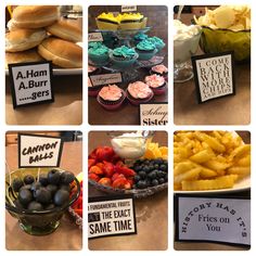 a bunch of food that is on a table with some signs in front of them