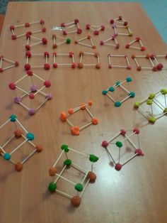 a wooden table topped with pops and pins