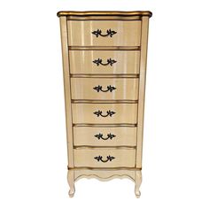 an antique style chest of drawers with black handles and knobs on the front, against a white background