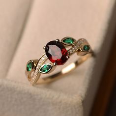 Lab Created Ruby Wedding Ring, July Birthstone Ring, Stacking Ring, 925 Sterling Silver Ruby Emerald Ring, Art Deco Ring, Gift For Her *Primary Stone: Lab Grown Ruby *Stone Color: Red *Stone Shape: Oval *Stone Size: 6x4mm *Secondary Stone Type: Emerald *Stone Size: 2x4mm *Stone Color: Green *Stone Shape: Marquise Other Stone : CZ Diamond Jewelry Type: Ring Metal: Silver Method: Cast Personalization: Possible Style: Wedding Ring Set Ring Size: We make rings from US 3 to US 16. This elegant ring i Garnet Wedding Rings, Ladies Silver Rings, Ruby Wedding Rings, Garnet Wedding, Smaragd Ring, July Birthstone Ring, Leaf Engagement Ring, Ruby Wedding, Ruby Engagement Ring