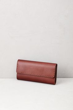 Designed for ultra-organization, the women's leather wallet is packed with all the details you need to hold all your credit cards, IDs, checkbook, cash, and more all in one place and right at your fingertips. This wallet is crafted of soft yet durable leather that easily coordinates with all your other accessories, making it an everyday essential you'll appreciate for many years. Brown Travel Wallet Rectangular Case, Brown Leather Wallet In Rectangular Case, Brown Leather Wallets In Rectangular Shape, Leather Wallet In Rectangular Case For Everyday Use, Versatile Rectangular Wallet For Daily Use, Versatile Wallets For Daily Use, Brown Leather Rectangular Wallet, Brown Rectangular Wallet For Everyday Use, Versatile Leather Trifold Wallet