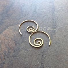 Small 14k gold filled spiral hoop earrings. Petite AND make a statement: win- win! Formed and cold forged from 20 gauge 14k gold filled wire into this small coil. The ends have been sanded for comfort in wearing, then polished to a light shine. * Small spiral hoop earrings are approximately 17mm in diameter. Please see measurement photo. You can also choose sterling silver at the dropdown to the right. If you are looking for the larger version of this style click here: https://www.etsy.com/listi Nickel Free Spiral Hoop Earrings Gift, Nickel-free Spiral Hoop Earrings As Gift, Nickel-free Spiral Hoop Earrings For Gift, Unique Spiral Hoop Earrings Gift, Gold Minimalist Spiral Wrap Earrings, Minimalist Gold Spiral Wrap Earrings, Swirl Shaped Nickel-free Hoop Earrings As Gift, Swirl Hoop Earrings Nickel Free Gift, Nickel-free Swirl Hoop Earrings Gift