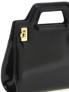 Wbella' calf leather mini handbag with fixed shaped handle, side bellows and Hook closure in satin finish and a removable shoulder strap. Composition: Versace Shop, Mini Handbag, Ferragamo Shoes, Bellows, Mini Handbags, Sneaker Wedge, Personalized Accessories, Leather Mini, Luxury Retail