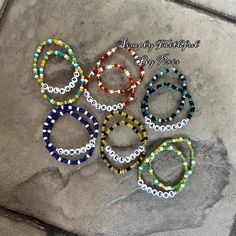 NFL football teams beaded bracelet sets. Cheap Adjustable Bracelets For Football Season, Nfl Beaded Bracelets, Football Team Bracelets, Nfl Bracelets, Braclets Diy, Team Bracelets, Football Bracelet, Bracelet Sets, Nfl Football Teams