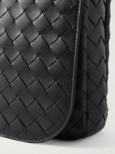 Bottega Veneta's messenger bag is crafted using the house's signature intrecciato technique, which involves meticulous handiwork weaving together strips of leather. It's generously sized to stow a 13-inch laptop and hardcover book and has two straps, giving you the option to carry it on your shoulder or crossbody. Leather Shoulder Bag With Top Handle And Interwoven Design, Classic Bags With Interwoven Design For Everyday Use, Business Intrecciato Weave Crossbody Bag, Designer Travel Shoulder Bag With Interwoven Design, Designer Leather Bags With Interwoven Design, Designer Travel Bags With Interwoven Design, Designer Top Handle Shoulder Bag With Interwoven Design, Classic Formal Bag With Interwoven Design, Intrecciato Weave Business Crossbody Shoulder Bag